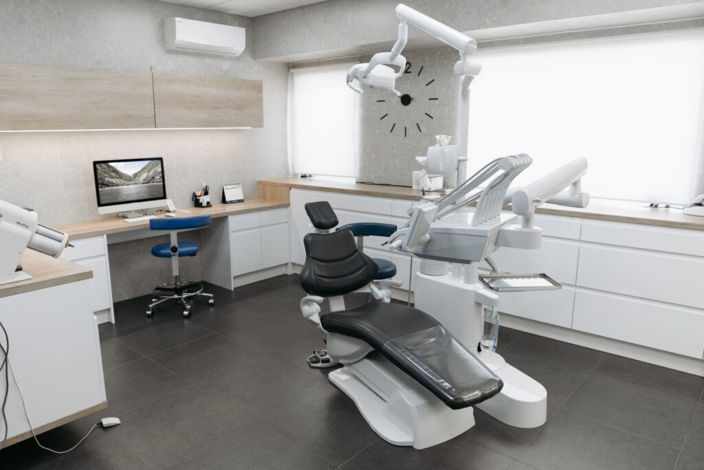 Smiling patient seated in a dental chair